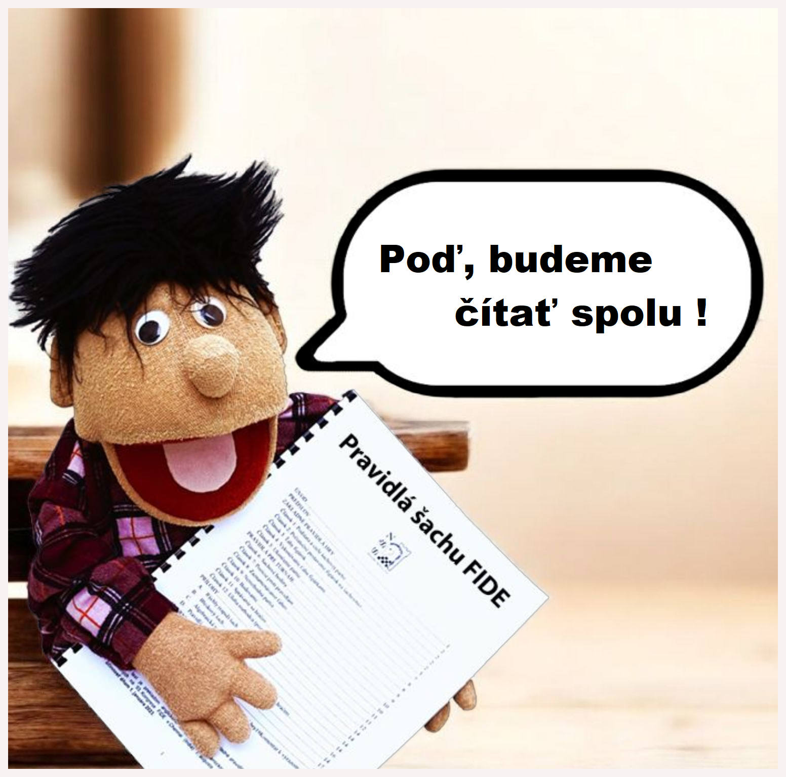 Jožko Šprtovský s Pravidlami šachu FIDE v rukách